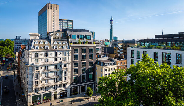 Aerial view of Hanover Square in London featuring green park space, surrounding classic architecture, and city streets on a clear day.