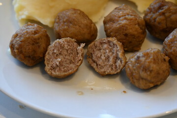 meatballs and mashed potatoes and food on a plate