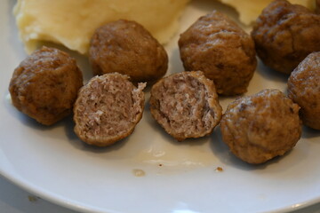 meatballs and mashed potatoes and food on a plate