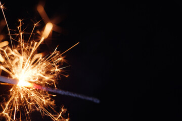 Golden spark of burning handheld firework