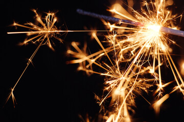 Golden spark of burning handheld firework