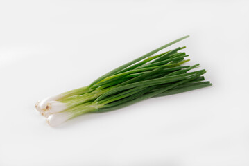 Fresh green onions isolated on white background.