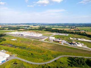 Obraz premium Aerial drone photo of fields and warehouses. 