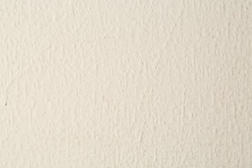 Beige textured surface as background, closeup view
