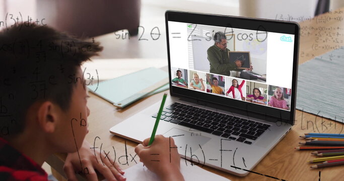 Attending online lesson, Asian boy solving math at home desk with laptop, green pencil, copy space - Powered by Adobe