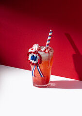Close up of typical chilean cocktail "terremoto" on a red background