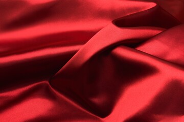 Shiny red silk cloth texture with soft waves