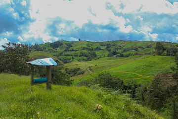 Image where you can see the peak of the mountain and some marvelous landscapes with clouds and...