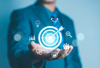 Businessman showing virtual target icon for business purpose, strategic planning for business growth and target customer group. Set business objectives goals, value, growth.	
