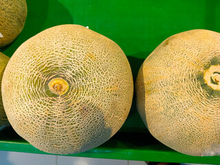 Round melons placed on shop shelves