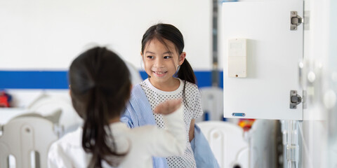 Back to School: Two Girls Smiling by School Lockers