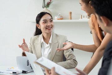 Business Meeting. Collaborative discussion among professionals with data presentation.