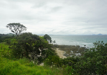 Beautiful view at Waipu beach in Whangarei, New Zealand on cloudy day.
