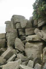 The unique and beautiful shape and composition of rocks at Waipu pancake rocks, New Zealand.
