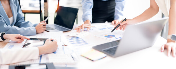 Business woman coworkers working together in boardroom, brainstorming, discussing and analyzing and planning business strategy.