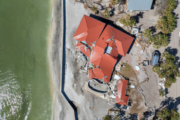 Destroyed house on ocean shore. Hurricane Milton consequences on Manasota Key, Florida. Storm surge...