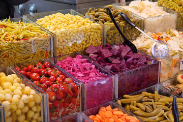 Colorful display of pickled vegetables at local market