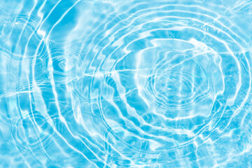 Blue water with ripples on the surface. Defocus blurred transparent blue colored clear calm water...