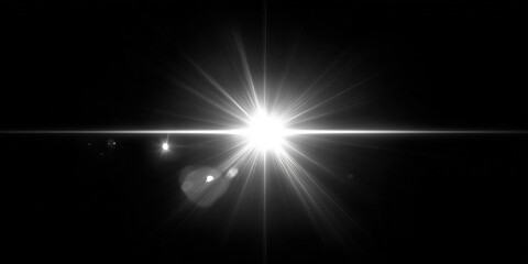 Obraz premium Bright star shining on dark background with lens flare effect