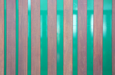 Wooden panels against a green background close-up abstract texture