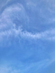 Clear Blue Sky with Wispy White Clouds