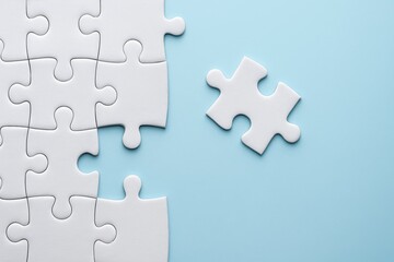 Fototapeta premium White Puzzle Pieces on Light Blue Background, One Missing Piece Ready to Fit Into the Jigsaw Puzzle, Concept of Completion and Problem Solving