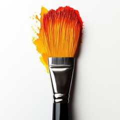 Paintbrush with vibrant orange and yellow paint strokes on white background, art supplies.