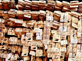 Closeup Wooden Plate of ema for hope of health, love and prosperity. Ema are small wooden plaques...