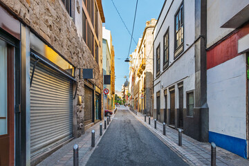 A narrow pedestrian street in the historic old town center of Santa Cruz de Tenerife, Spain, on the Canary island of Tenerife in the Atlantic Ocean.