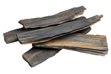 Agarwood Chips Stacked on Black Background, Fragrant Resin Rich Wood