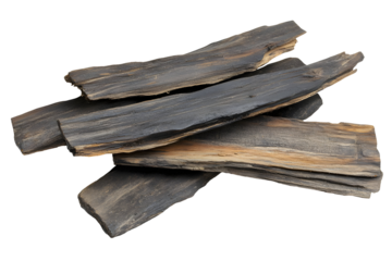 Agarwood Chips Stacked on Black Background, Fragrant Resin Rich Wood