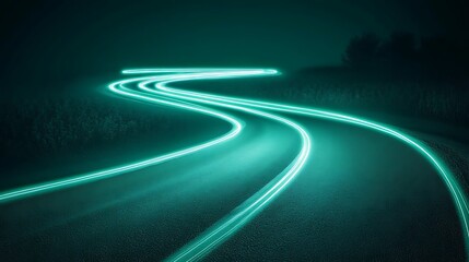 Winding road at night, glowing light trails