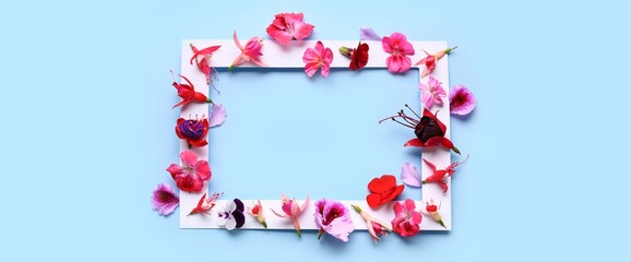 Paper frame with beautiful flowers on blue background