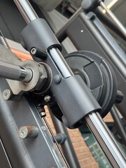 Close up view of metal plate on the Smith machine. Concept of weight training exercise in a gym or fitness center