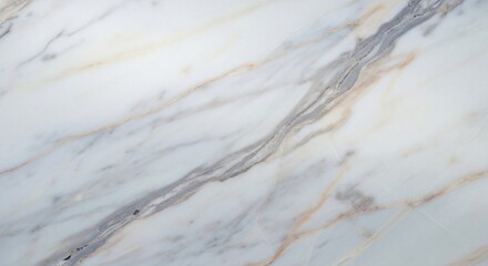 Close up of white marble with gray and gold veins running diagonally across the surface of the stone