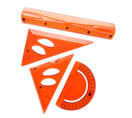 Orange straight and triangle plastic rulers with protractor on white background