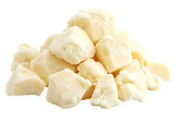 Pile of creamy cocoa butter chunks isolated against a stark black background
