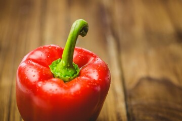 Fresh red pepper on wooden table