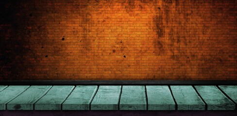 Green floorboard by brick wall