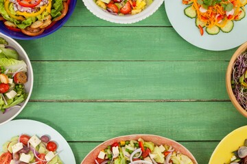 Various fresh food on green wooden table