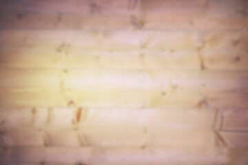 Flat design interior wooden plank wall is showing natural grain patterns and knots in soft focus