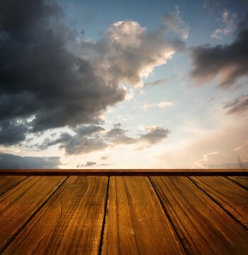 Fototapeta Wooden planks against cloudy sky