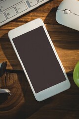 Flat design is featuring smartphone on wooden desk with keyboard, mouse, green apple, lens cap