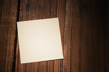 White paper fallen on wooden floor