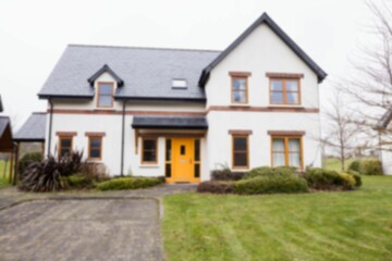 Facade of white house against sky