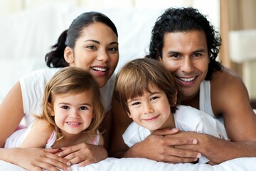 Happy family smiling at the camera