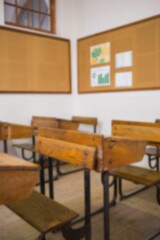 Defocused image of desk in classroom
