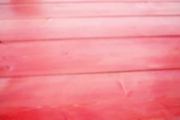 Fototapeten Blurred horizontal wooden planks are showing in flat design with red-pink paint, knots and grain © vectorfusionart