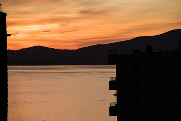 Scenic view of lake mountain during sunset