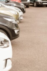 Cropped image of cars parked on road